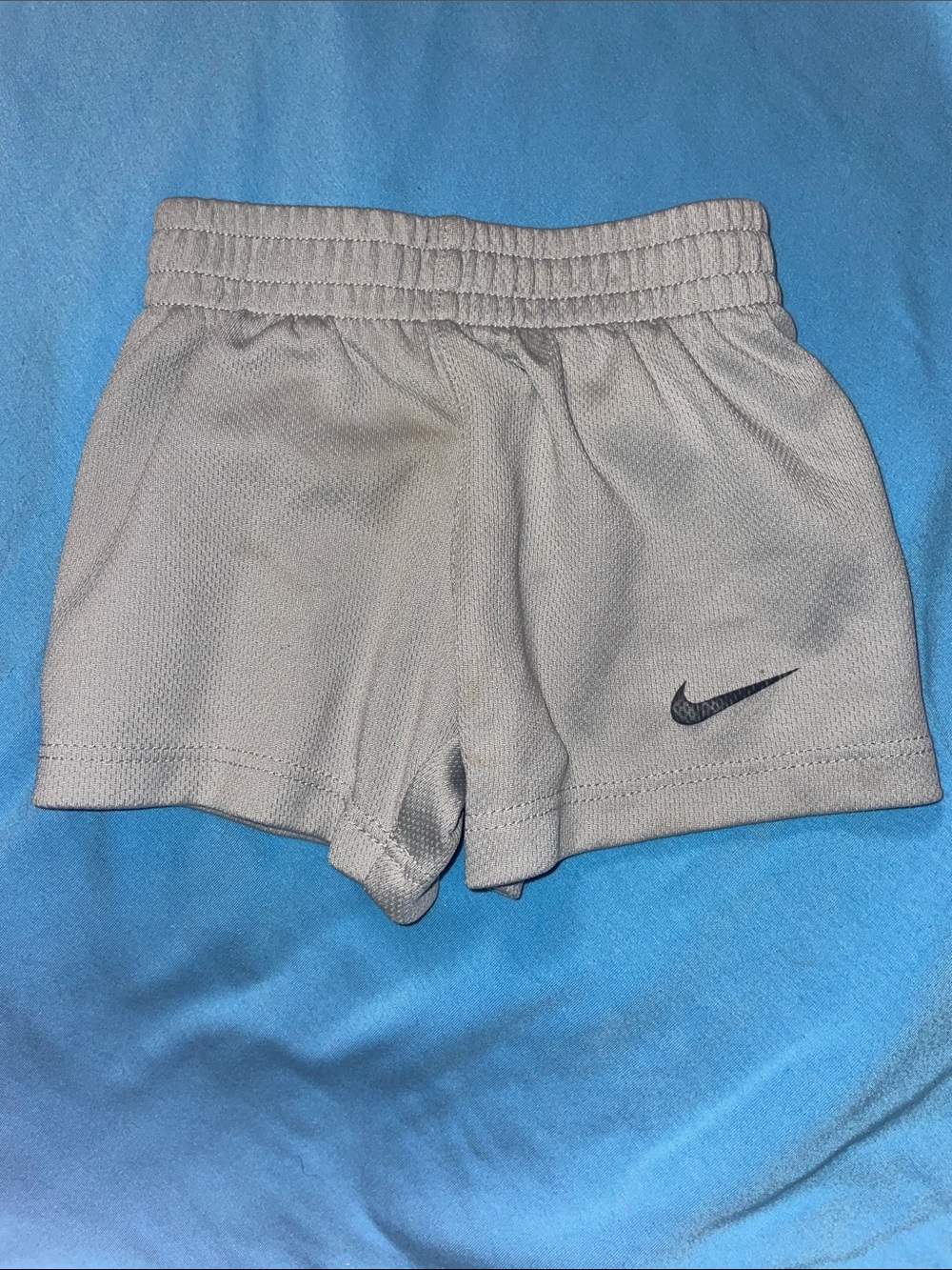 Nike Light Gray Athletic Shorts with Black Swoosh